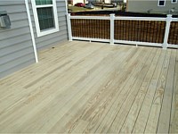 <b>Wood deck with white vinyl railing and gate</b>